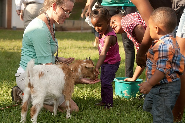 Children with farm animals