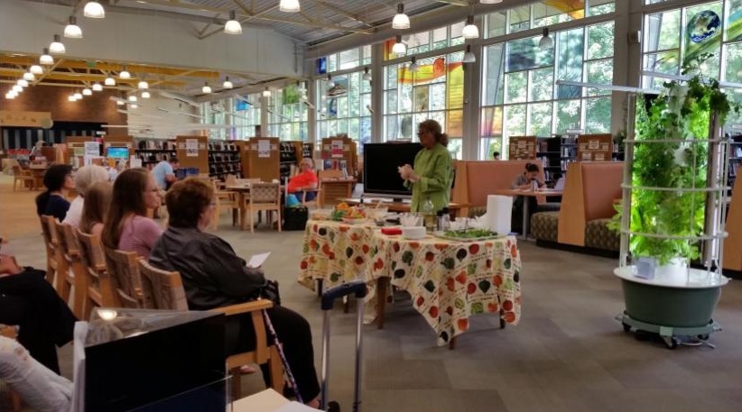 A chef makes a presentation to a group at library