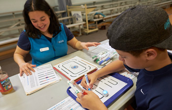 Child engaging with coding activity.