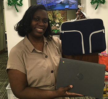 Young woman hoding laptop and carry case.