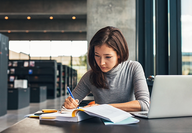 Woman doing research in library