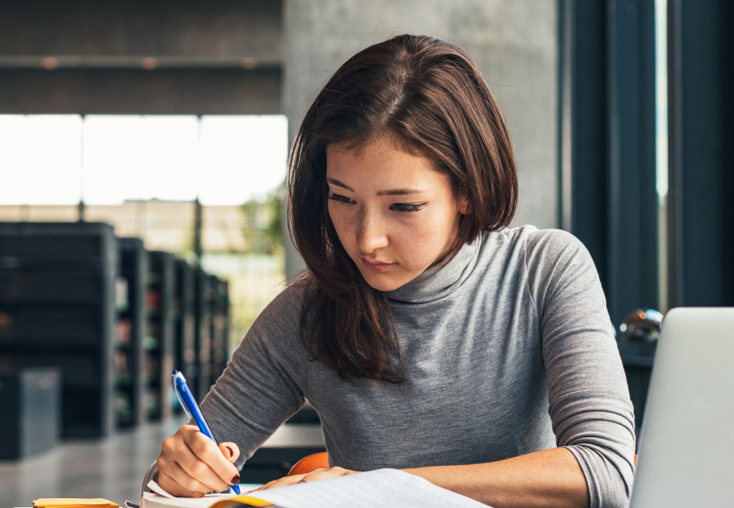 College student studying in library