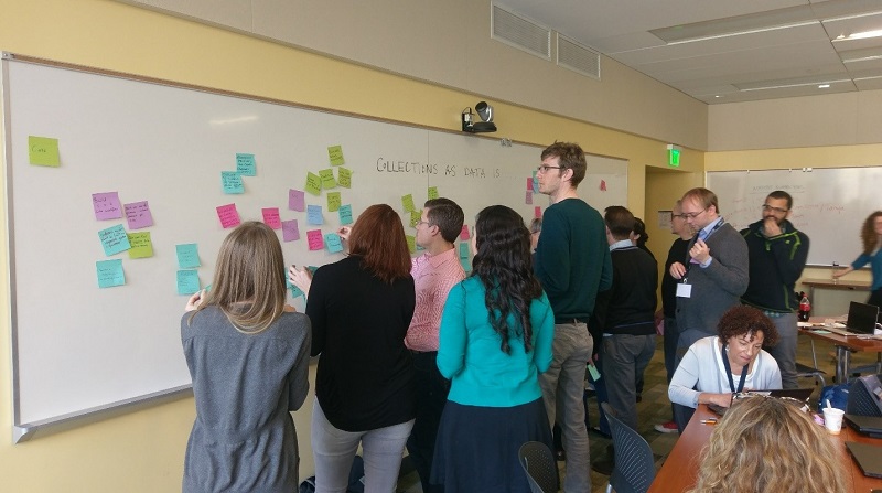 Attendees discuss library collections in classroom