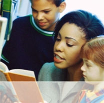 Image of a school librarian reading to children. Washington State Library.