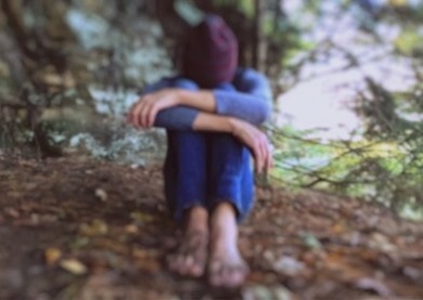 youth sitting in nature