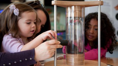 Children learn how to magnetize carbon nanotubes in Port Discovery’s NANO exhibit. Photo Credit: Ken Stanek Photography