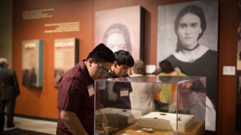 Two museum visitors view the Borderlands of Southern Colorado exhibit.