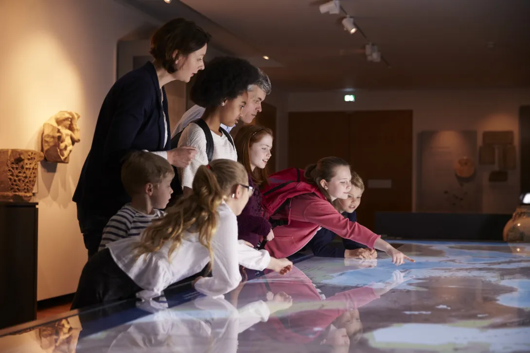 People viewing a display in a museum